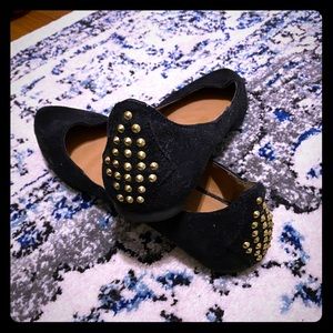 Black suede studded flats.